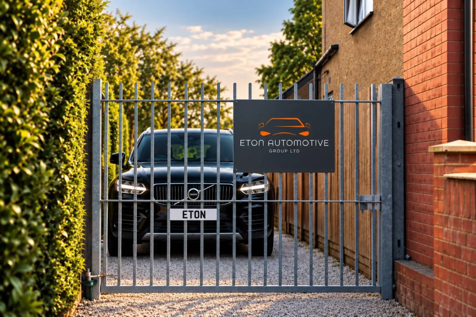 Black Volvo behind the gated Eton Automotive forecourt
